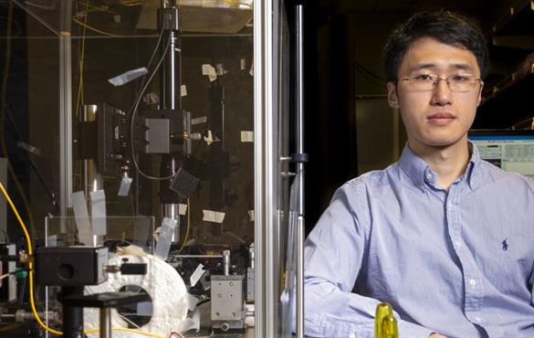 Guangming Zhao, a PhD candidate in the McKelvey School of Engineering, in the research lab of Lan Yang. (Photo: Sid Hastings/Washington University)