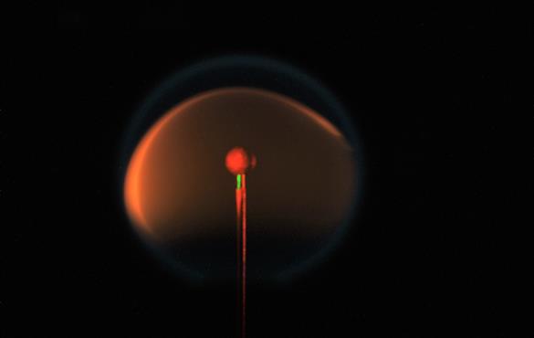 An experiment aboard the International Space Station aims to determine the true nature of soot formation during combustion. This is the spherical shape of a flame in microgravity. (Credit: Richard Axelbaum/NASA)