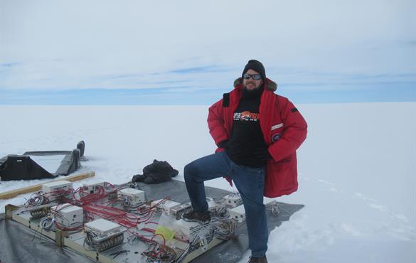 Richard Bose with research equipment in Antarctica, where a WashU team goes annually to study cosmic rays.